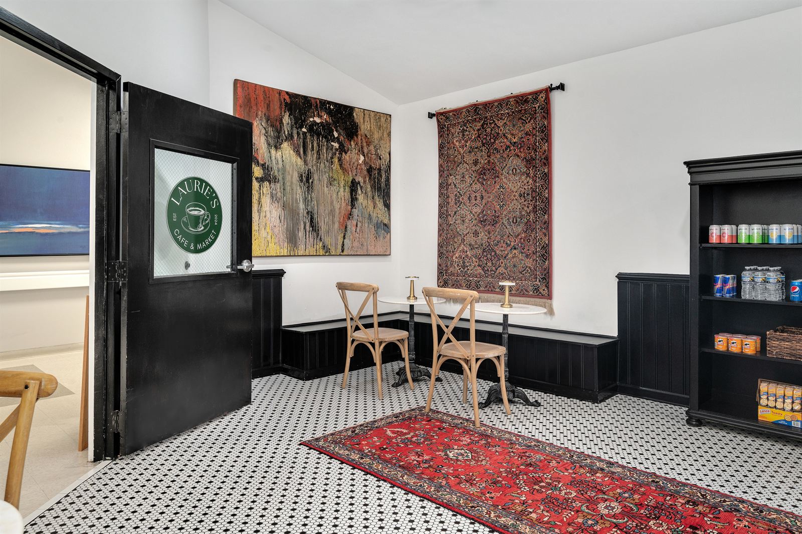 Cafe seating beneath the heirloom rug