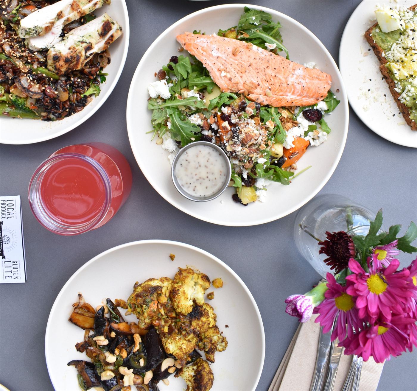 Fresh salmon, roasted vegetables, and salads prepared on-site