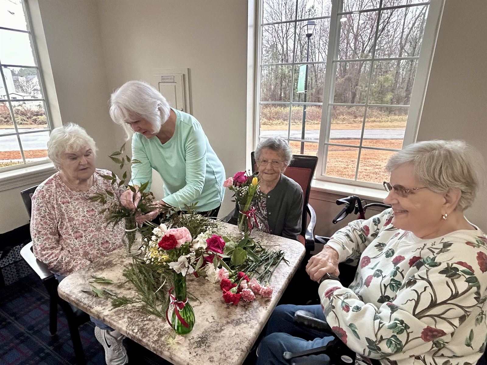 Residents arranging fresh flowers
