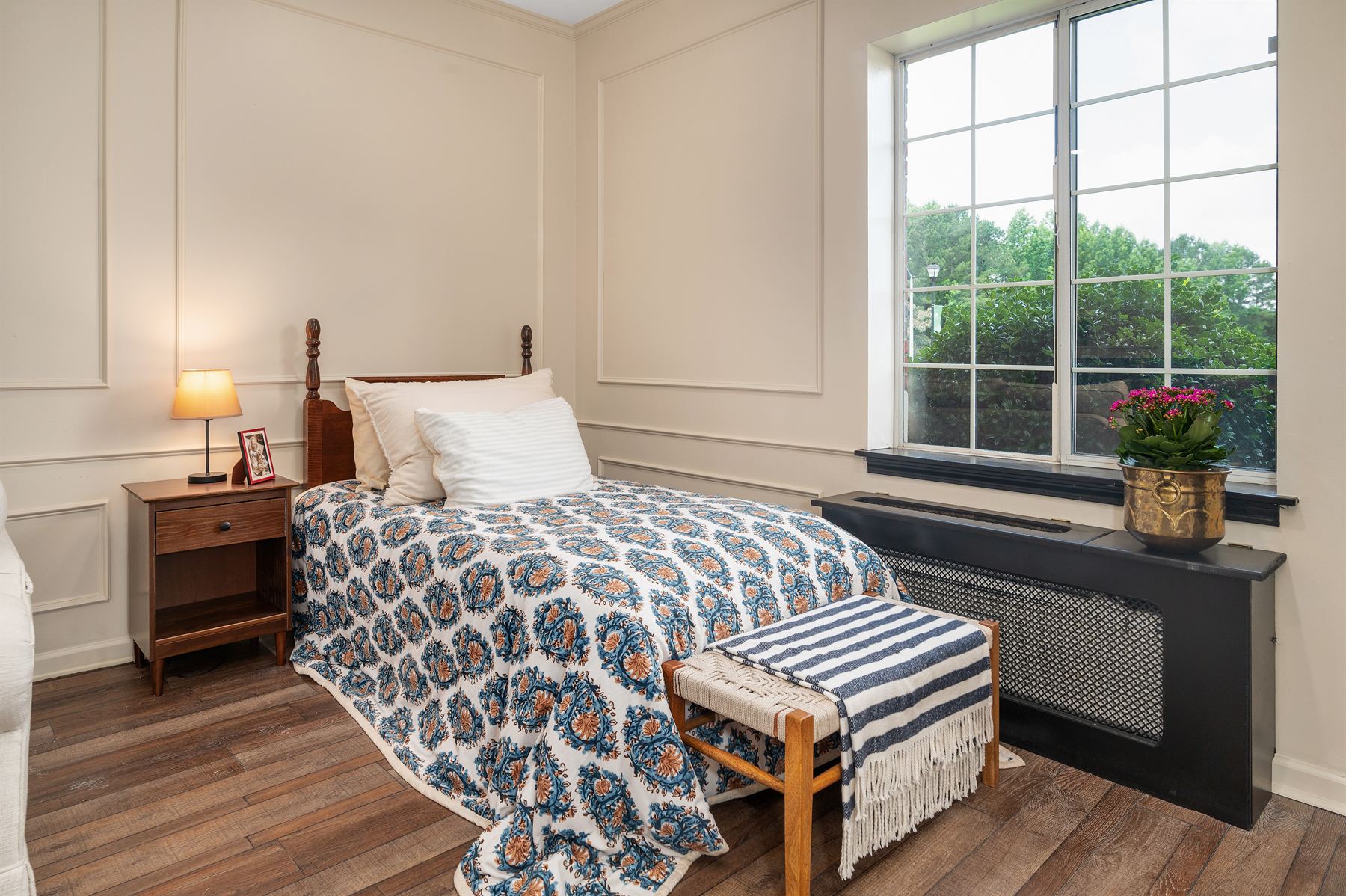 A bedroom with garden views